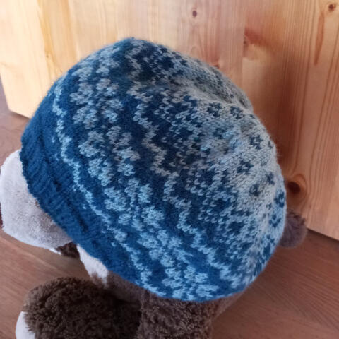 Hand knitted woollen beanie with dark and light blue pattern